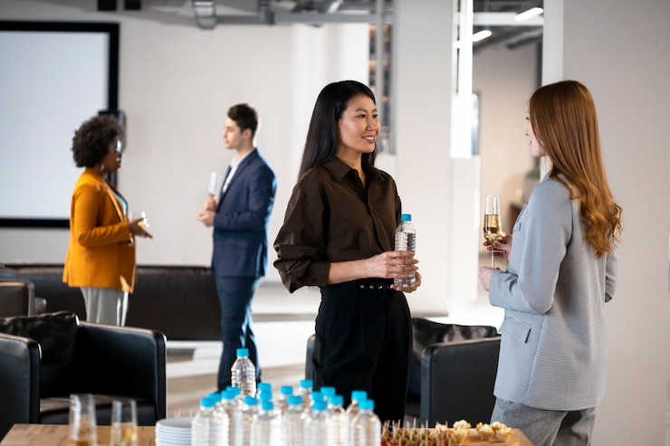 close-up-smiley-women-chatting-company-event_23-2149304732 Reasons to Attend the Biggest Startup Event of 2023